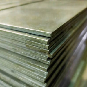 stack of mild steel sheets, full-frame close-up view with selective focus, industrial material background